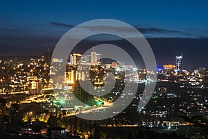 Kigali city centre skyline and surrounding areas lit up at night photo