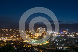 Kigali city centre skyline and surrounding areas at night photo