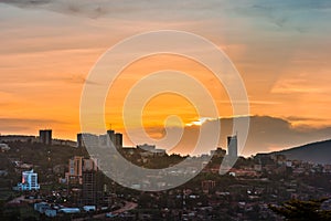 Kigali city centre skyline and surrounding areas under colorful clouds at sunset. Rwanda photo