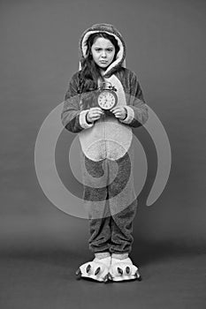 Kigurumi pajamas for your comfort. funny child in bunny pajama. Different times of day and children schedule concept