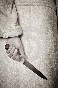 Killer woman with a knife. Violence aggression. Criminal murderer