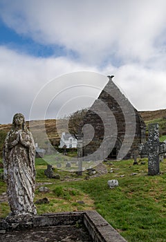 Kilmalkedar church with cloudy sky