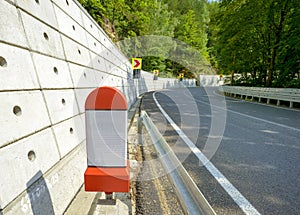 Kilometer stone post on the roadside