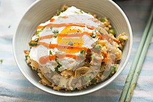 Kimchi fried rice with fried egg and sriracha