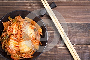 Kimchi or kimchee on black plate