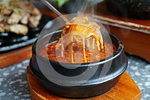 Kimchi Soup with tofu and pork belly served in clay pot, One of the most loved of all the stews in Korean cuisine, Most popular photo