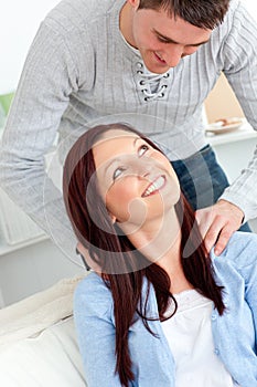 Kind boyfriend massaging his girlfriend's neck