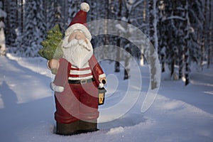 Kind Santa Claus in winter forest. With a free space for text.