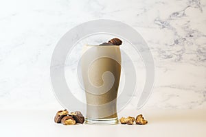 Kinder Bueno Milkshake in tall transparent glass. with copy space photo