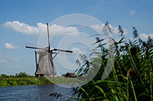 Kinderdijk, The Netherlands, August 2019. On a beautiful summer day a historic windmill, in perfect condition, in the Dutch