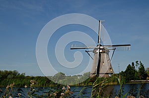 Kinderdijk, The Netherlands, August 2019. On a beautiful summer day a historic windmill, in perfect condition, in the Dutch