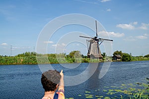 Kinderdijk,The Netherlands,August 2019.On a beautiful summer day a historic windmill,in perfect condition,in the Dutch countryside