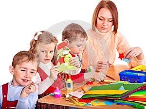 Kindergarden teacher with children.