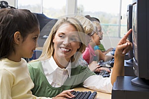 Kindergarten children learn how to use computers