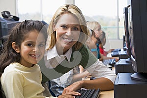 Kindergarten children learn how to use computers