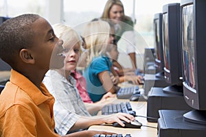 Kindergarten children learning to use computers