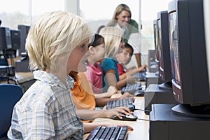 Kindergarten children learning to use computers