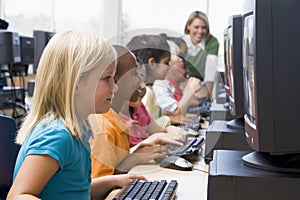 Kindergarten children learning to use computers