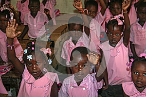 Kindergarten children in rural Haiti model their new friendship bracelets.