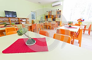 Kindergarten classroom with small chairs and tables