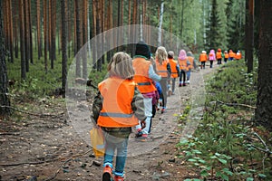 Kindergarten in Forest, Children Walking with Tutors in Wild Park, Finnish Forest School, Forest Kindergarten photo