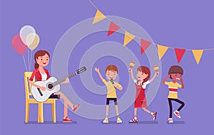 Kindergarten music party, female teacher playing guitar