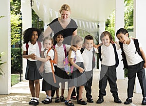 Kindergarten students standing together in school