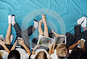 Kindergarten students using digital devices photo