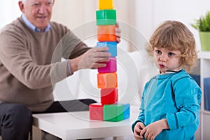 Kindergartner and colorful building blocks photo