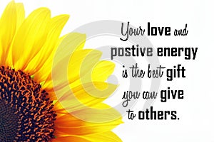 Kindness inspirational quote - Your love, positive energy is the best gift you can give to others. Half sunflower petals on white. photo