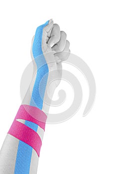 Kinesio tape on female hand.