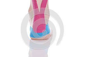 Kinesio tape on female heel.