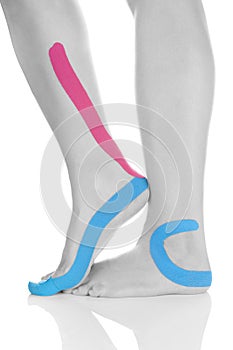 Kinesio tape on female leg.