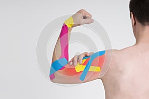 Kinesio tape, kinesiology taping on human hand