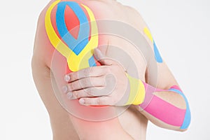 Kinesio tape, kinesiology taping on man hand