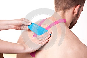 Kinesio taping on upper back
