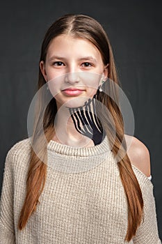 Kinesiology tape placed on the neck of a young caucasian teenager girl