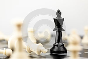 The King in battle chess board game concept of business leader