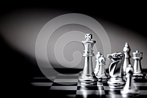 The King in battle chess board game concept of business leader for market target strategy.
