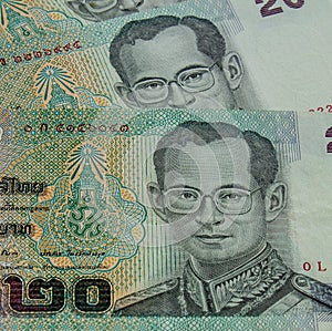 King Bhumibol Adulyadej (or Rama IX) in the uniform of the supreme commander on 20 Thai baht banknote