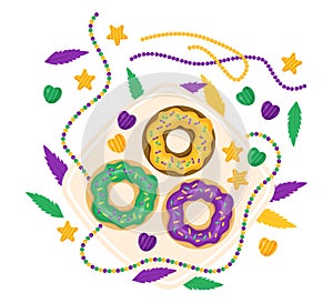 King Cake. Festive Donuts with colorful icing, beaded necklaces, feathers on plate. Mardi Gras carnival. Holiday Fat