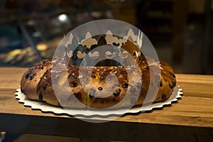 king cake with a golden crown in a bakery store showroom