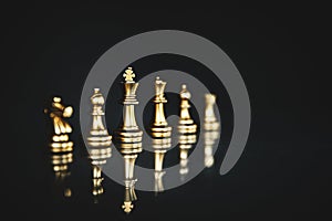 King chess pieces stand leader with team concepts of challenge or business teamwork volunteer or wining and leadership strategic