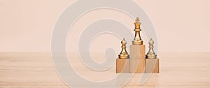 King chess pieces stand leader with team concepts of challenge or business teamwork volunteer or wining and leadership strategic