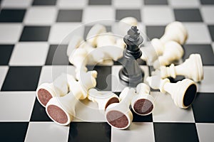 A King Chess is placed on a pile of coins.using as background business concept and Strategy concept with copy space for your text