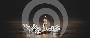 King chess standing challenge winner with falling chess on chess board concept of winning or teamwork and leadership strategy or s