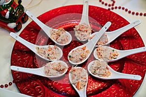 King crab appetizers served in slab spoons