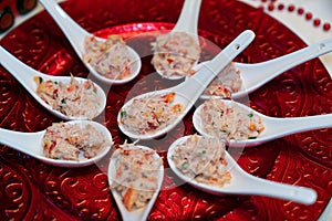 King crab appetizers served in slab spoons