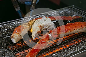 King crab legs cooked on a barbecue in the city of Osaka in Japan.