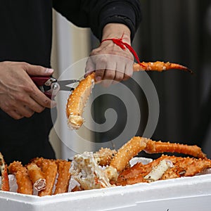 King crab legs at a food stall at the Tsukiji Outer Market in the city of Tokyo, Japan.